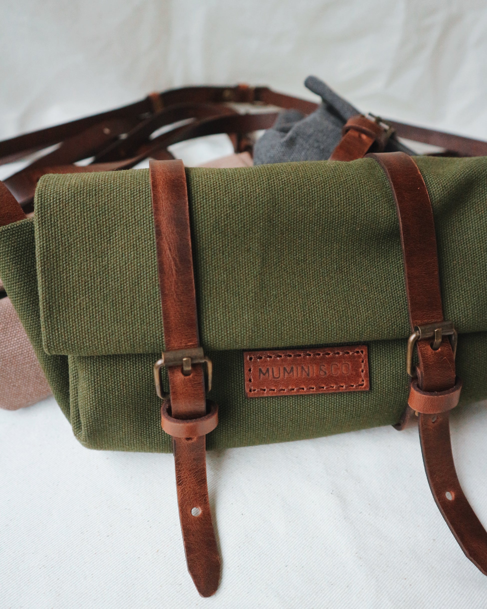 Green bag with brown straps